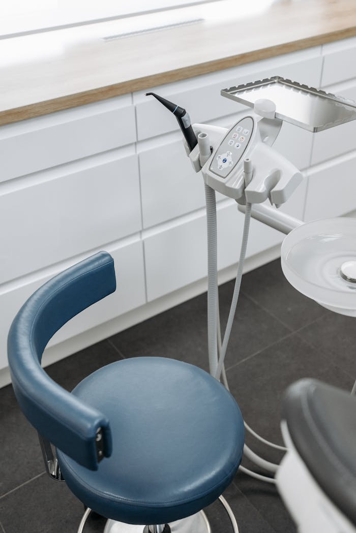 High-angle view of dental chair and equipment in a modern healthcare office.